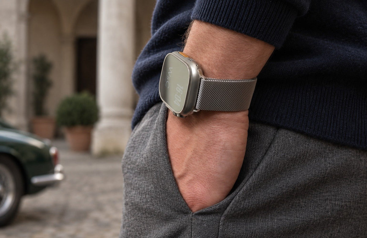 Man wearing the silver WsC Milanese Loop Apple Watch strap, standard non-diamond lifestyle photograph