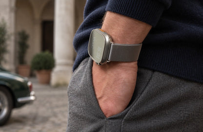 Man wearing the silver WsC Milanese Loop Apple Watch strap, standard non-diamond lifestyle photograph