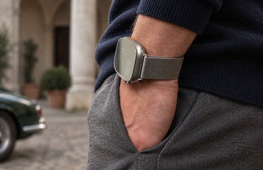 Man wearing the silver WsC Milanese Loop Apple Watch strap, standard non-diamond lifestyle photograph